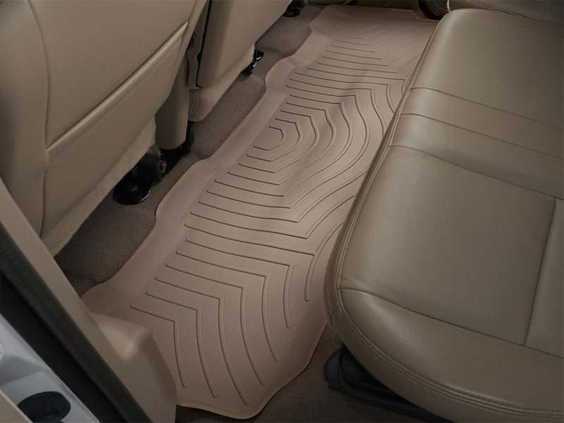 WeatherTech 99-10 Ford F250 Super Duty Crew Rear FloorLiner - Tan installed in vehicle, providing absolute interior protection.