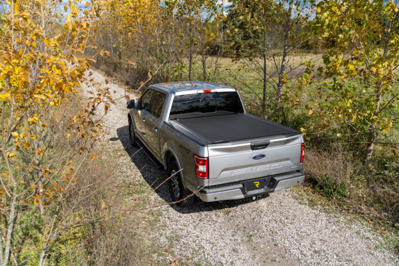 BAK 19-21 Chevy Silverado/GM Sierra Revolver X4s 5.10ft Bed Cover (New Body Style) on offroad truck in nature.