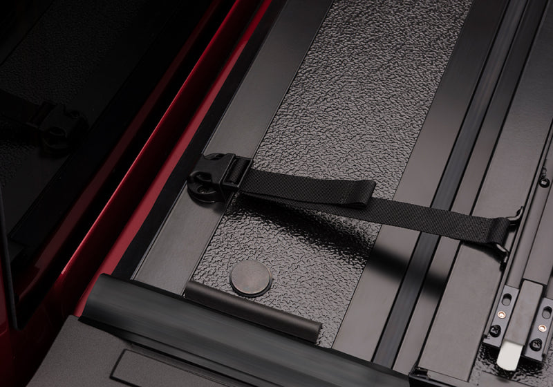 Detail of BAK 99-07 Ford Super Duty 8ft Bed BAKFlip G2 latch system.
