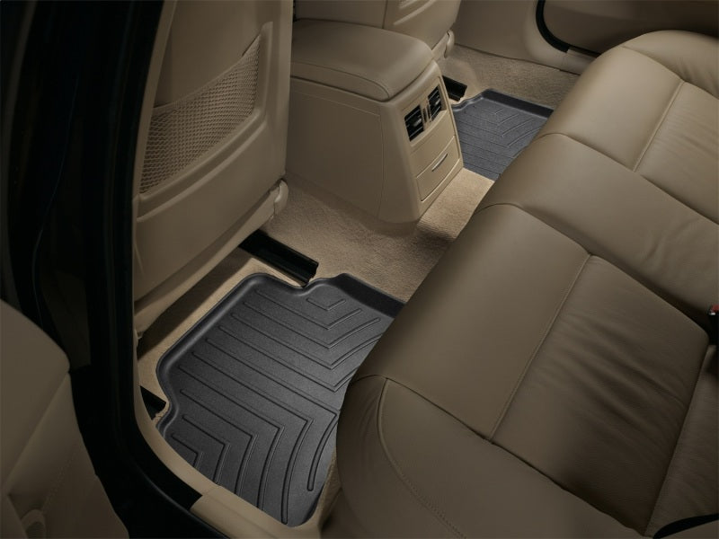 WeatherTech 06-12 BMW 3-Series Rear FloorLiner - Black in vehicle interior.