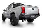 Addictive Desert Designs 2024 Toyota Tacoma Stealth Rear Bumper on truck with offroad tires and performance upgrades.