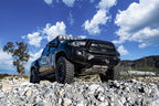 ICON 05-23 Toyota Tacoma Lower Control Arm Kit installed on offroad truck with performance upgrades.