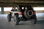 DV8 Offroad 18-23 Jeep Wrangler JL Slim Fender Flares in parking lot.
