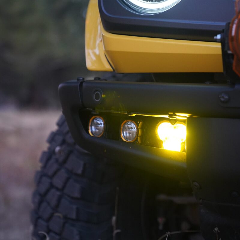 KC HiLiTES 2021+ Ford Bronco FLEX ERA 3 Dual Mode SAE Fog Light Pocket Kit installed on a yellow Ford Bronco.