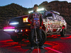 Rigid Industries Rock Light Kit- Cool White (4 lights) with illuminated truck at dusk.