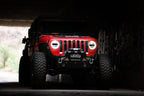 DV8 Offroad 2018+ Jeep Wrangler JL/Gladiator LED Projector Headlights in a rugged setting.