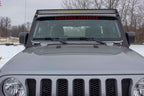 Fishbone Offroad 2018+ Jeep Wrangler JL Windshield Light Bracket mounted on a gray Jeep, showcasing offroad lighting.