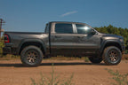 ICON 21-23 RAM TRX Billet UCA DJ Pro Kit on rugged terrain