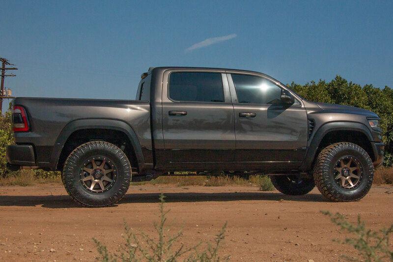 ICON 21-23 RAM TRX Billet UCA DJ Pro Kit on rugged terrain
