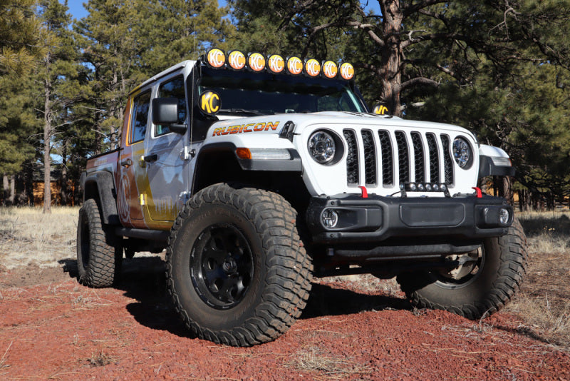 KC HiLiTES 6in. Round Soft Cover (Pair) - Black w/Yellow KC Logo on lifted Jeep Gladiator