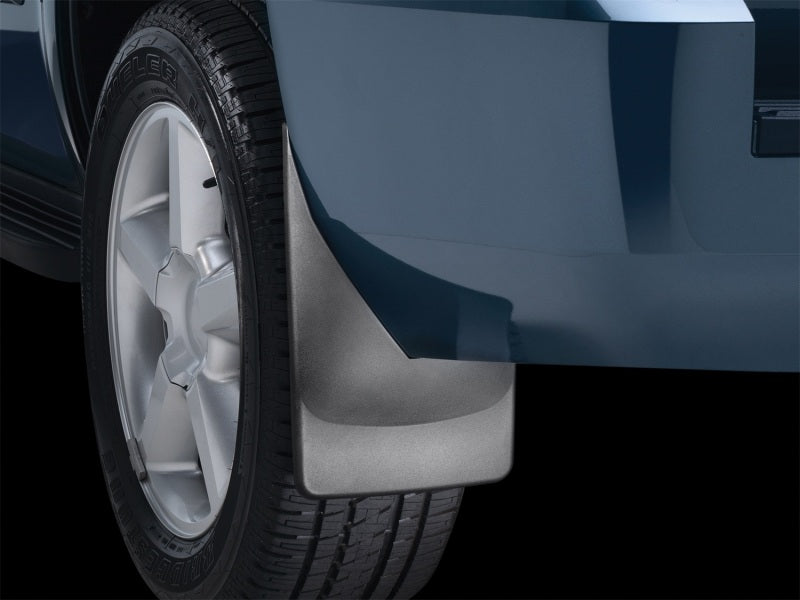 WeatherTech 07-13 Chevrolet Tahoe No Drill Mudflaps - Black installed on tire