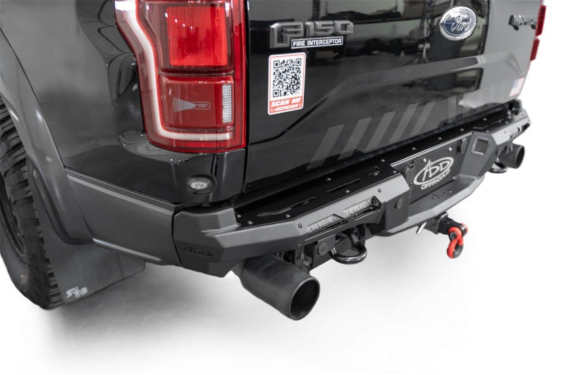 Addictive Desert Designs17-20 Ford F-150 Raptor Phantom Front Bumper on black truck, showcasing offroad performance upgrades.