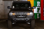 DV8 Offroad 21-22 Ford Bronco Factory Modular Front Bumper Bull Bar on black Ford Bronco in garage
