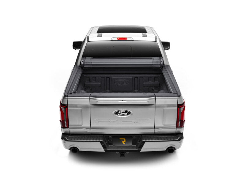 BAK 21-24 Ford F-150 5.7ft. Bed BAKFlip Revolver X4ts installed on a silver truck