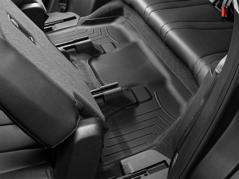 WeatherTech 22-24 Acura MDX Rear FloorLiner - Black installed in back seat of vehicle.