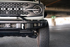 DV8 Offroad 21-22 Ford Bronco Factory Bumper Pocket Light Mount (Pair) 3in LED Pod Lights on parked Bronco.