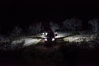 KC HiLiTES C-Series C2 LED 2in. Backup Area Flood Light 20w (Pair Pack System) - Black illuminating off-road area at night.