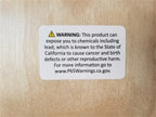 Warning label about chemical exposure risk including lead.