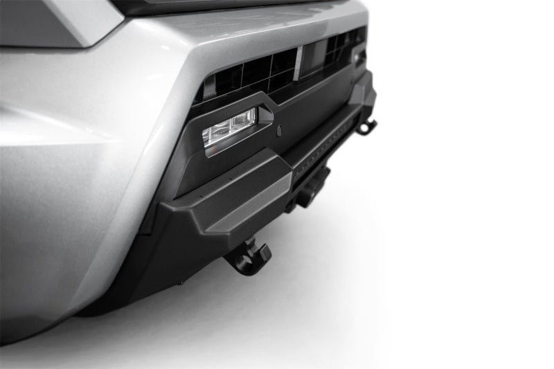 Addictive Desert Designs 2024 Toyota Tacoma Stealth Center Mount Winch Front Bumper detail with offroad lighting