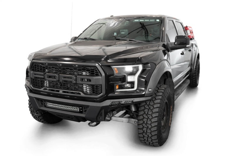 Addictive Desert Designs17-20 Ford F-150 Raptor Phantom Front Bumper on a lifted truck with offroad tires and accessories.