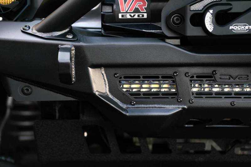 DV8 Offroad 18-23 Wrangler JL/Gladiator JT Spec Series Front Bumper with offroad lighting and recovery gear features.