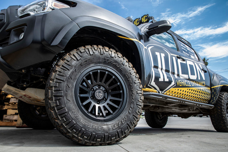 ICON Recon SLX 17x8.5 6x5.5 BP 25mm Offset 5.75in BS 95.1mm Bore Satin Black Wheel on offroad truck with tires