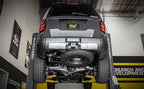 Magnaflow 24+ Toyota Land Cruiser Overland Cat-Back Exhaust System installed on raised vehicle.