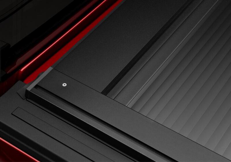 Close-up of Retrax 05-15 Tacoma 5ft Double Cab RetraxONE XR truck bed cover with Trax Rail System.