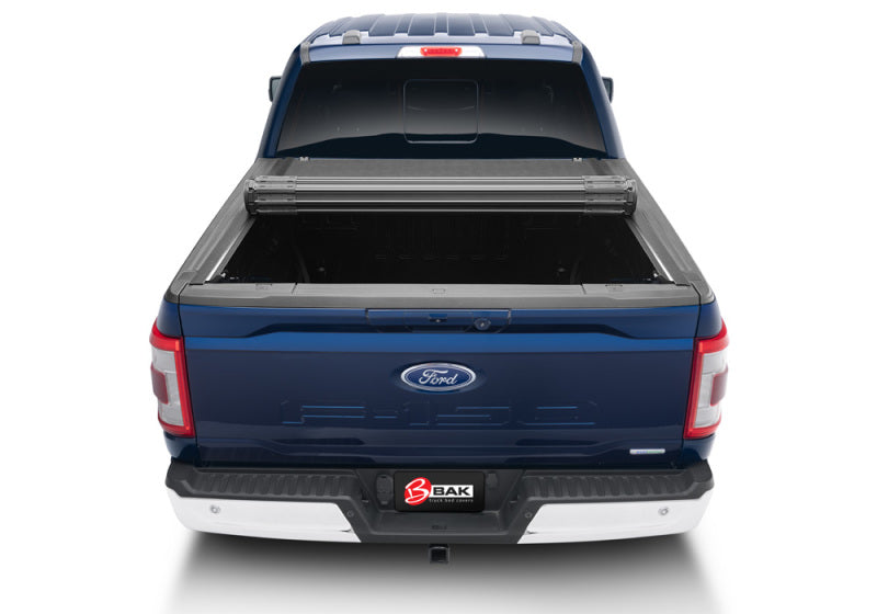 BAK 21-22 Ford F-150 (Incl. 2022 Lightning) Revolver X4s 5.7ft Bed Cover installed on blue truck view from rear