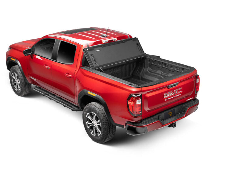 BAK 2024 Toyota Tacoma 5ft Bed BAKFlip MX4 Bed Cover on red truck