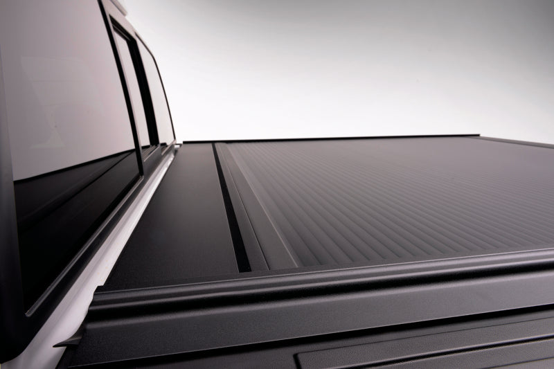 Retrax 09-up Ram 1500 6.5ft Bed / 10-up Short Bed RetraxONE MX on truck bed, showcasing durable design and matte finish.