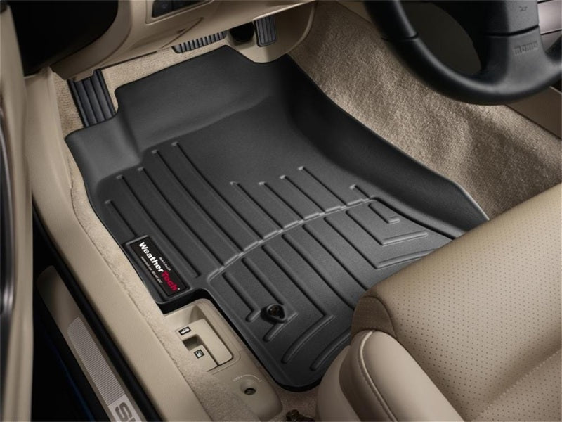 WeatherTech 05-09 Subaru Legacy Sedan Front FloorLiner - Black in vehicle interior, premium custom fit for ultimate protection.