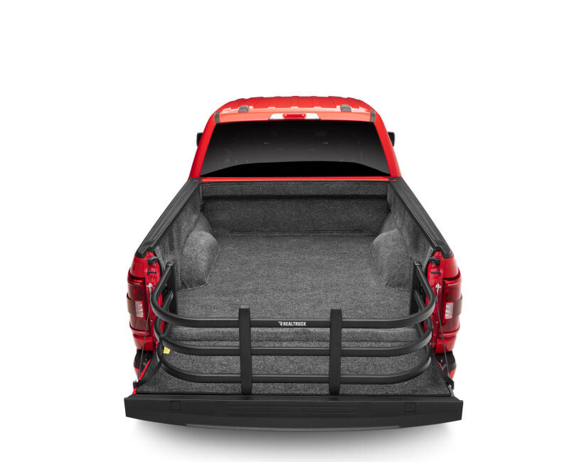 AMP Research 04-22 Ford F-150 (Excl. 04 Heritage) / 07-21 Toyota Tundra Bedxtender HD Max - Black in truck bed.
