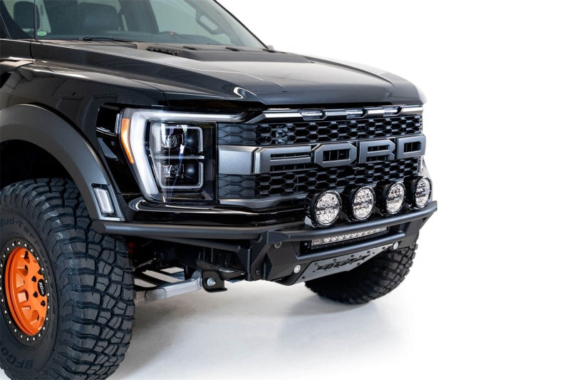 Addictive Desert Designs 21-22 Ford Raptor PRO Bolt-On Add-On Light Hoop on truck front with LED lights.