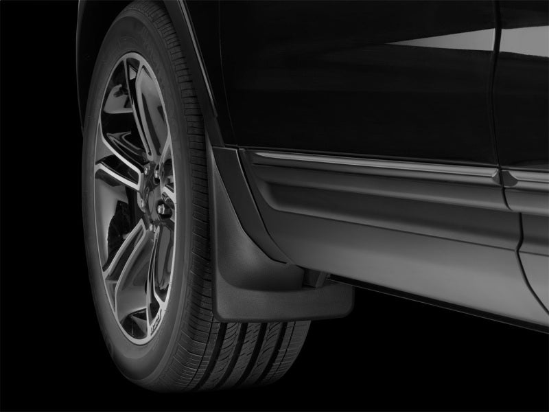 WeatherTech 11+ Ford Explorer No Drill Front Mudflaps installed on vehicle