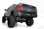 Addictive Desert Designs 22-23 Toyota Tundra Stealth Fighter Winch Rear Bumper on lifted truck with off road tires.