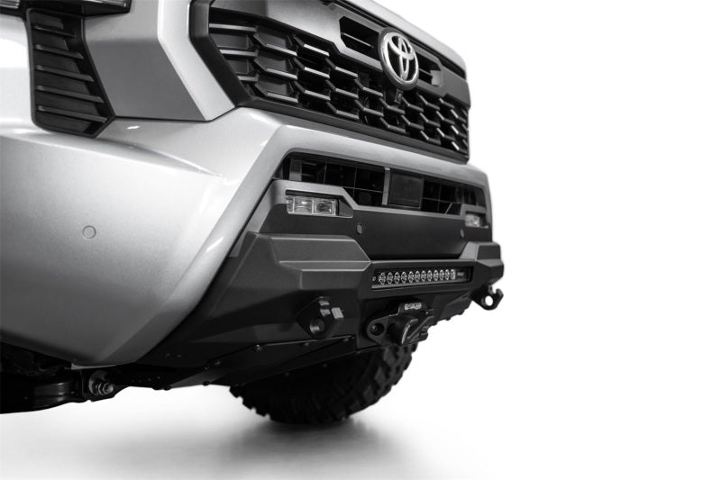 Addictive Desert Designs 2024 Toyota Tacoma Stealth Center Mount Winch Front Bumper with offroad lighting.