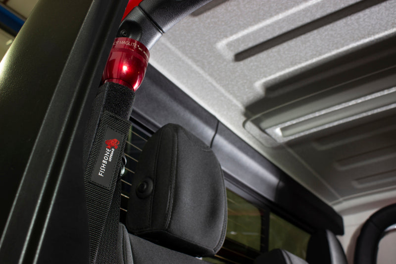 Fishbone Offroad Roll Bar Flashlight Holder in a Jeep interior