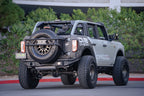 DV8 Offroad 21-22 Ford Bronco FS-15 Series Rear Bumper with spare tire and off road parts.