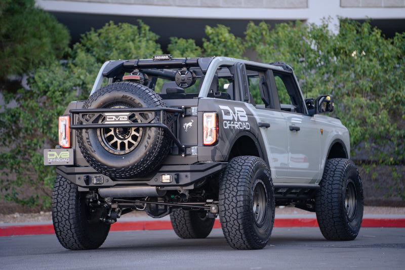 DV8 Offroad 21-22 Ford Bronco FS-15 Series Rear Bumper with spare tire and off road parts.