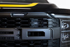 Addictive Desert Designs 21-22 Ford Raptor Adaptive Cruise Control Relocation Bracket installed on front grille.
