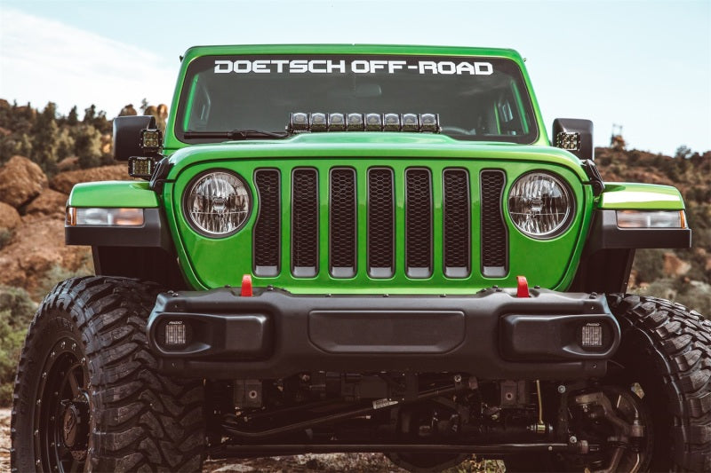 Rigid Industries 2018 Jeep JL - Hood Mount Kit - Mounts 20in Adapt Series on a modified green Jeep, showcasing offroad lighting.