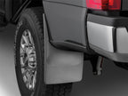 WeatherTech 17+ Ford F-250/350/450/550 (W/O Flares/Lip Molding) No Drill Mudflaps - Black mounted on truck wheel.
