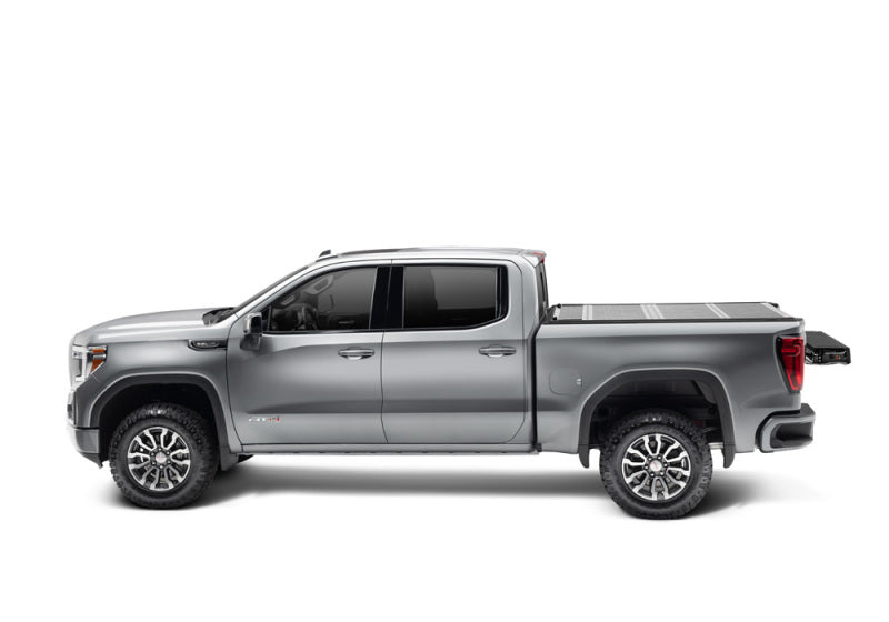 BAK 2020 Chevy Silverado 2500/3500 HD 6ft 9in Bed BAKFlip F1 on silver truck with offroad parts and accessories