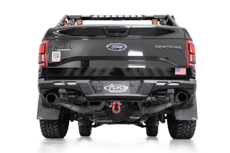 Addictive Desert Designs17-20 Ford F-150 Raptor Phantom Front Bumper on offroad truck with exterior accessories.