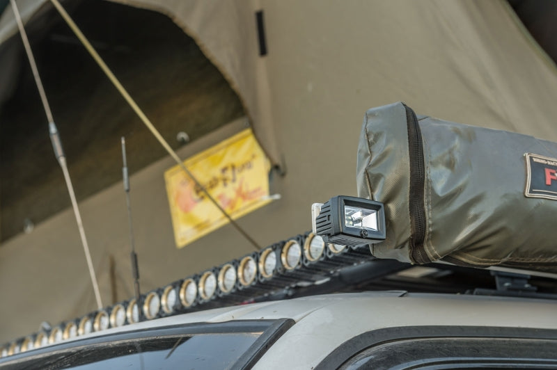 KC HiLiTES C-Series C2 LED 2in. Backup Area Flood Light 20w (Pair Pack System) - Black mounted on off-road vehicle roof
