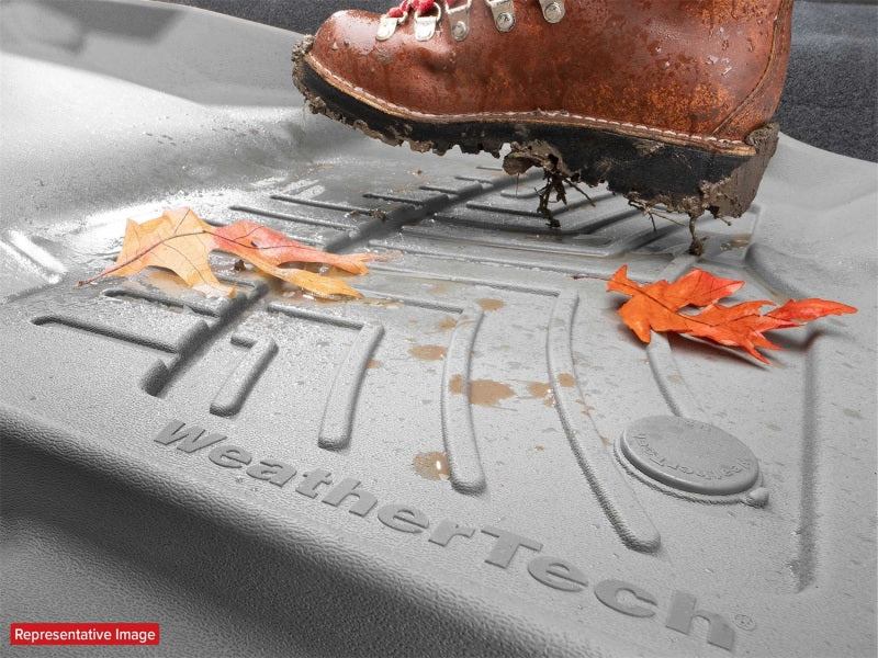 WeatherTech 18-20 Toyota Tacoma Double Cab Rear FloorLiner - Black with dirt and leaves