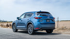 Borla 17-20 Mazda CX-5 2.5L AT AWD 4DR 2in S-Type Rear Section Exhaust on blue CX-5 in a scenic setting.