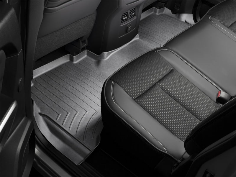 WeatherTech 2016+ Nissan Titan XD Crew Cab Rear FloorLiner - Black in vehicle interior.