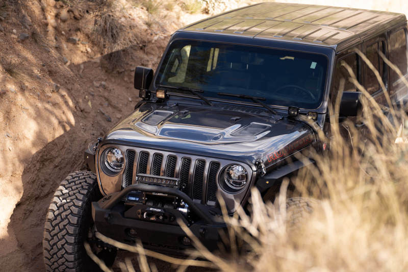 DV8 Offroad 18-22 Jeep Gladiator JT Cowl Light Bar Bracket installed on rugged terrain